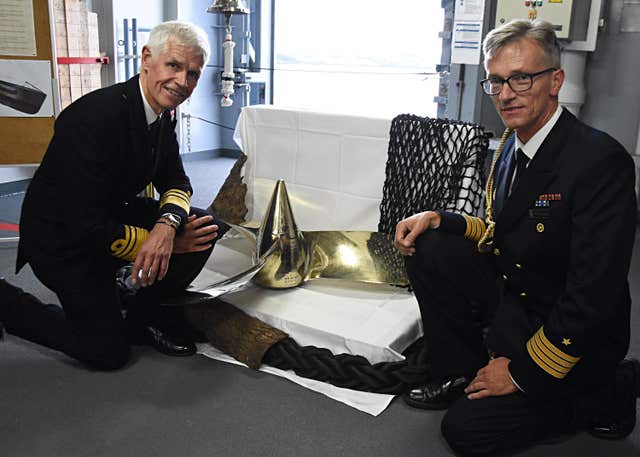 Vice Admiral Sir Alan Massey, left, with Captain Matthias Schmidt and the propeller