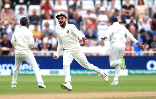 Virat Kohli celebrates the wicket of Joe Root