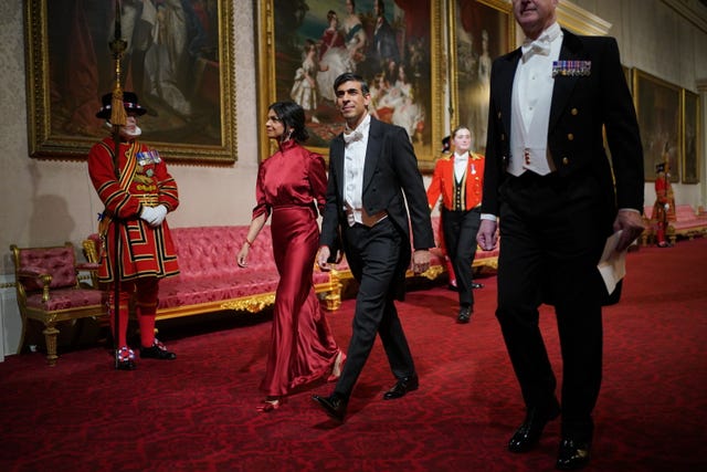 Rishi Sunak and his wife Akshata Murty arrive for the state banquet 
