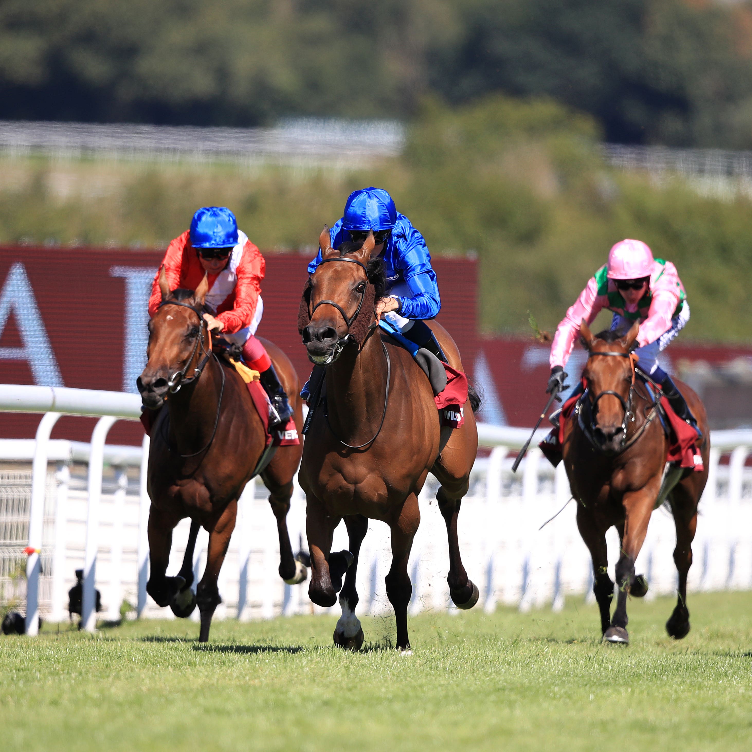 Wild Illusion and William Buick (blue silks) seen winning the Nassau Stakes at Goodwood