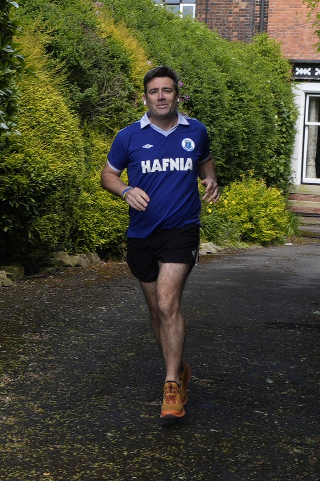 Andy Burnham outside his house in Warrington