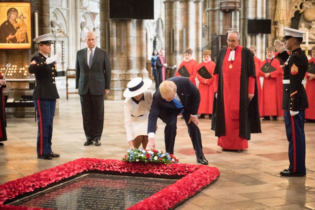 Donald Trump, with his wife Melania and the Duke of York, places a wreath on the Grave of the Unknown Warrior at Westminster Abbey 