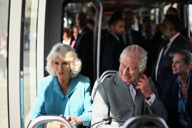 Charles and Camilla travel by electric tram to a reception at Place de la Bourse in Bordeaux