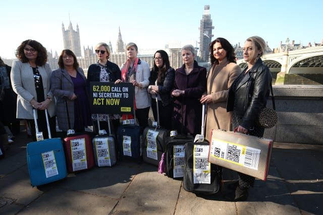 Heidi Allen, second right, joins women impacted by Northern Ireland’s strict abortion laws who are carrying suitcases symbolising the women who travel from Northern Ireland for abortions across Westminster Bridge demanding legislative change