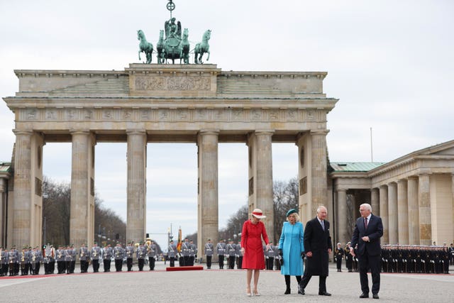 German President Frank-Walter Steinmeier, right, and his wife Elke Buedenbender, left, with the King and the Queen Consort during the ceremonial welcome at the Brandenburg Gate, Berlin, at the start of their state visit to Germany 