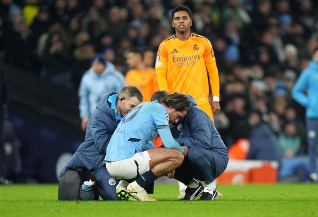 Manchester City’s Jack Grealish receives treatment after his injury against Real Madrid