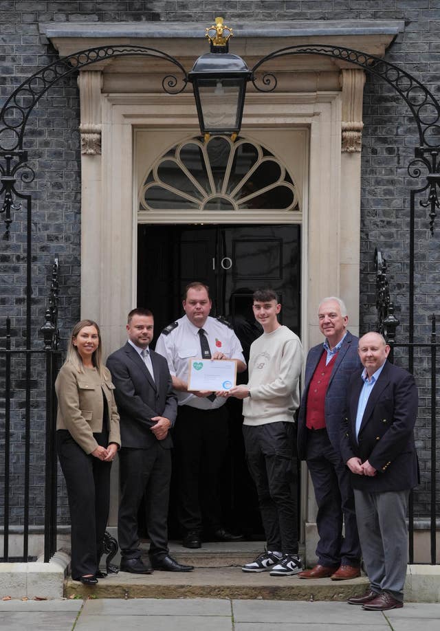 Jack Hurley, his father Colin, and other campaigners hand in the petition to 