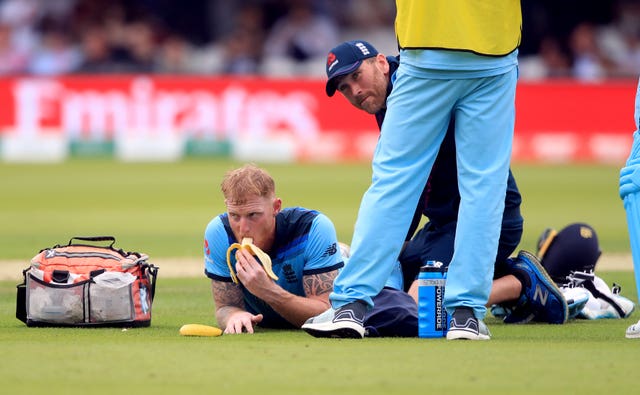 England’s Ben Stokes eats a banana whilst receiving treatment from a physio