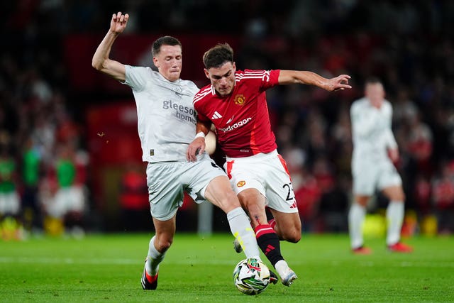 Barnsley's Mael de Gevigney (left) and Manchester United midfielder Manuel Ugarte battle for the ball during Tuesday's Carabao Cup clash