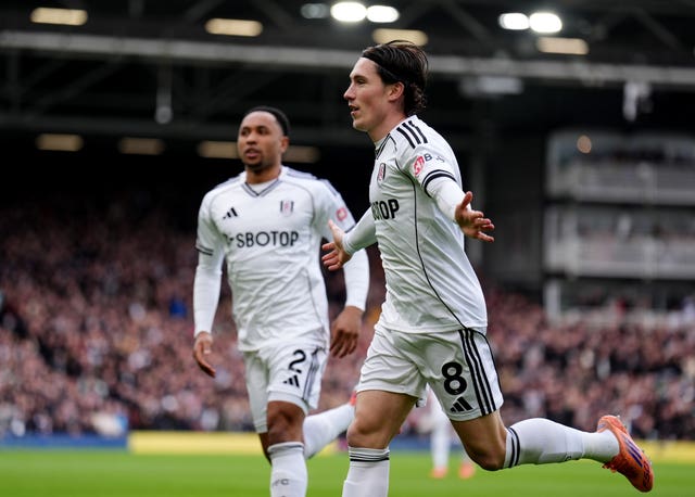 Fulham’s Harry Wilson, right, celebrates his opening goal against Tottenham