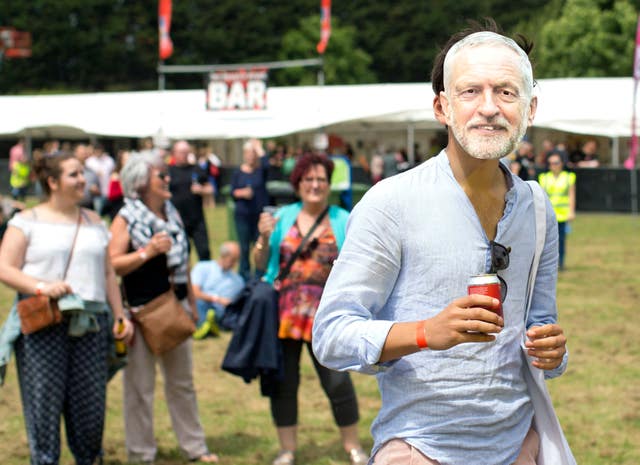 A man wearing a mask of Jeremy Corbyn at Labour Live