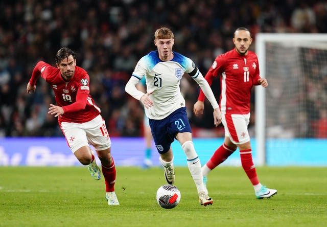 England''s Cole Palmer (centre) gets away from Malta’s Bjorn Kristensen