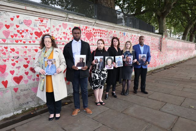 Bereaved people at the Memorial Wall 