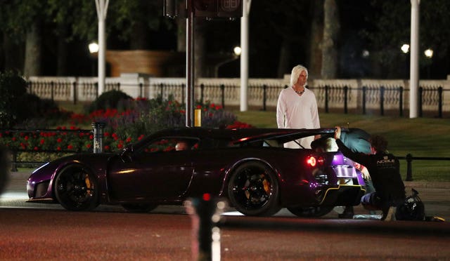 Film crew prepare a supercar for a chase sequence