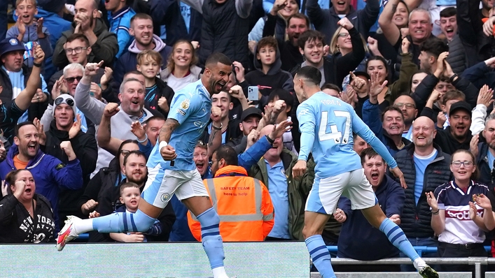 Manchester City’s Phil Foden (right) celebrates scoring his side’s first goal of the game with team-mate Kyle Walker (Martin Rickett/PA)