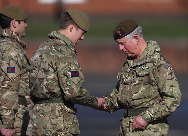 The Prince of Wales presents campaign medals.