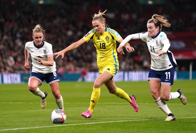 Sweden’s Fridolina Rolfo (centre) battles for the ball with England’s Georgia Stanway (left) and Lauren Hemp battle for the ball during the UEFA Women’s Euro 2025 qualifying round League A, 