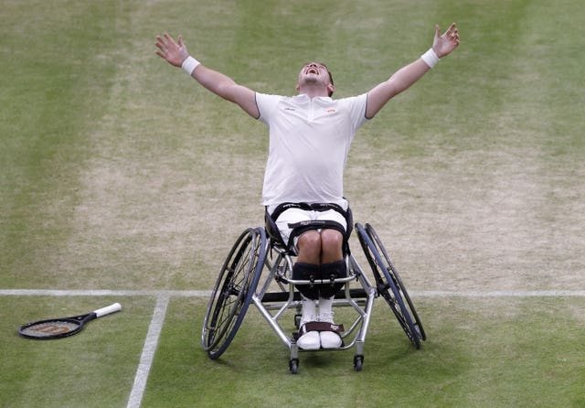 Alfie Hewett celebrates after he and Gordon Reid won a late-night wheelchair doubles thriller on Court One