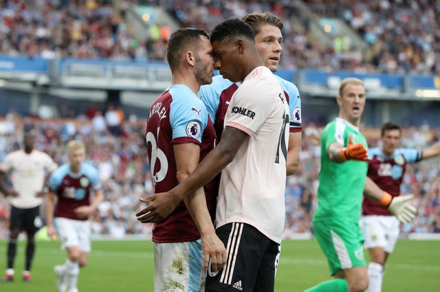 Rashford (right) was sent off for headbutting Phil Bardsley as United won at Burnley.