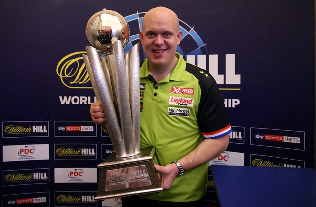 Michael van Gerwen with the World Championship trophy 