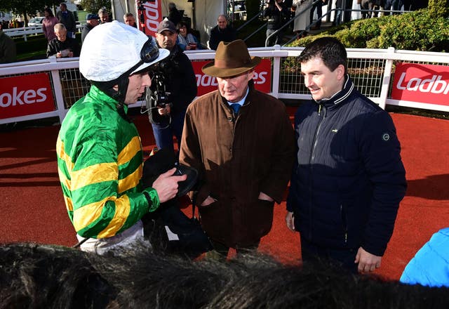 Jockey Mark Walsh in the winners enclosure with trainer Padraig Roche and Frank Berry after winning the Value Cabs 3-Y-O Hurdle on Cougar during day two of the Ladbrokes Festival of Racing at Down Royal Racecourse (PA)