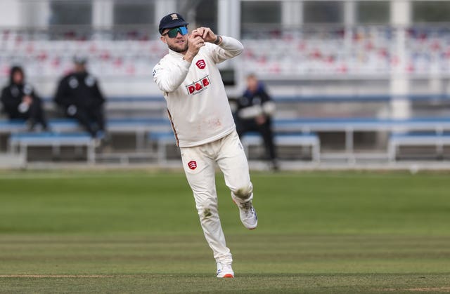 Essex’s Sam Cook catches out Surrey’s Dom Sibley