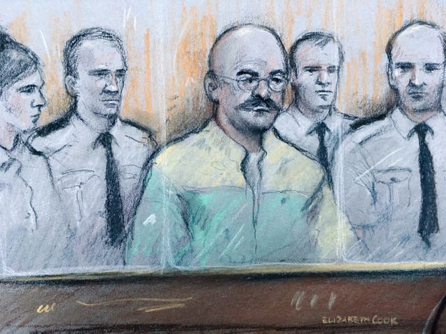 Court artist sketch of Charles Bronson listening as prison governor Mark Docherty gives evidence at Leeds Crown Court