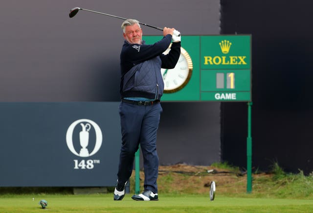 Darren Clarke tees off the first hole