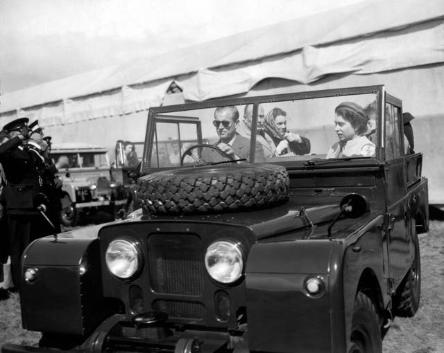 The duke has been a fan of Land Rovers for many years and is pictured here at the wheel of one in 1955, driving the Queen as she inspects jumps at the European Horse Trials in Windsor Great Park. PA