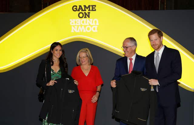 Prince Harry and Meghan Markle receive Invictus Games jackets from Australian PM Malcolm Turnbull (Alastair Grant/PA)