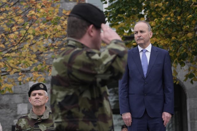 Micheal Martin and Chief of Staff Lieutenant Sean Clancy, review Irish troops