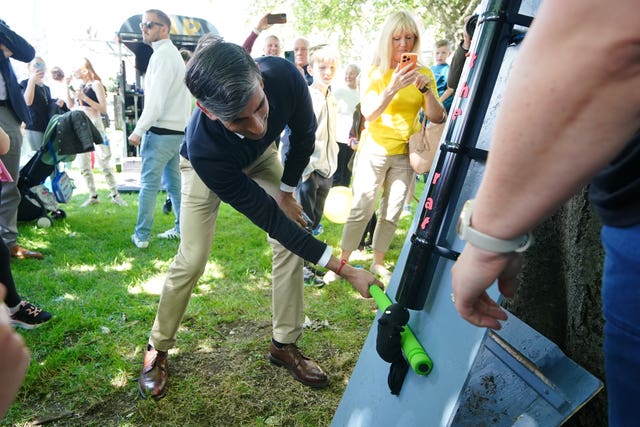 Rishi Sunak visits village fete on home soil after D-Day events ...