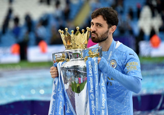 Bernardo Silva poses with the Premier League trophy