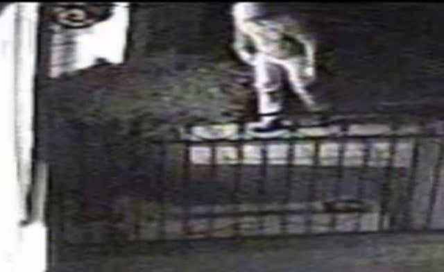 CCTV still of a raid by an armed burglar at a house in Maidenhead (Surrey Police/PA)
