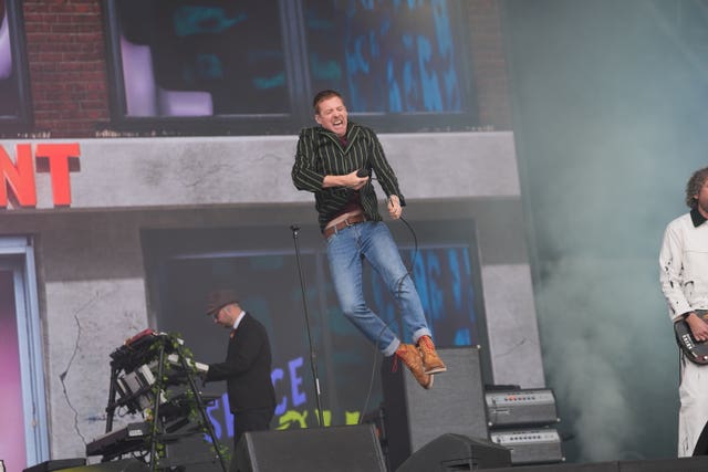 Lead singer Ricky Wilson leaps in the air as Kaiser Chiefs perform on the Pyramid Stage on Saturday