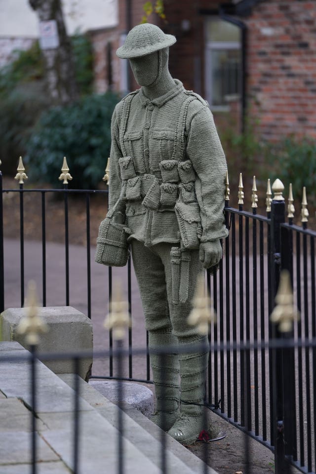 A life-sized knitted soldier