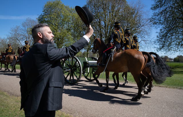 A man salutes the King’s Troop Royal Horse Artillery 