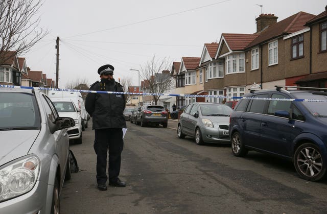 Police at the scene in Tavistock Gardens, Ilford 