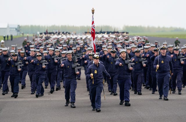 Members of the Royal Navy march during a full tri-service and Commonwealth rehearsal at RAF Odiham in Hampshire, ahead of their involvement in the second procession that accompanies King Charles III and Queen Camilla from Westminster Abbey back to Buckingham Palace, following the coronation service on May 6 at the abbey in London