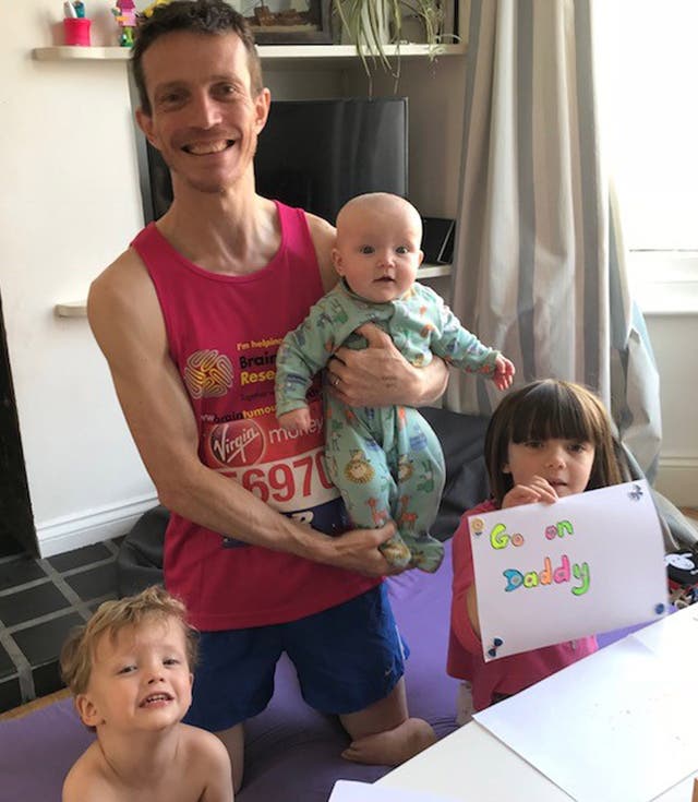 Angus Cameron, pictured with children Lola, Fraser and Edith, has hoped to finish sub three hours (Family handout/PA)