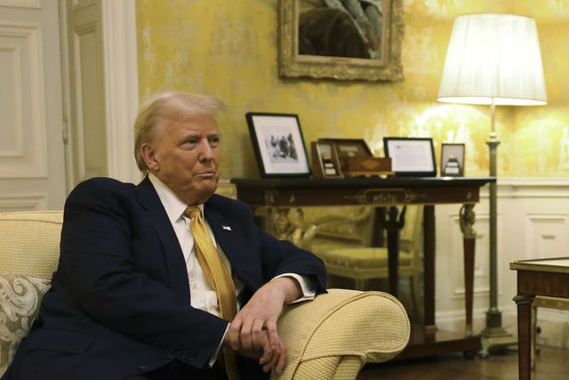 US President-elect Donald Trump sitting on a sofa