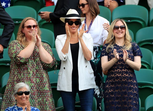 The Duchess of Sussex, centre, was on Court One to see Serena Williams in action