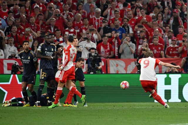 Bayern Munich''s Harry Kane shoots from a free-kick against Real Madrid