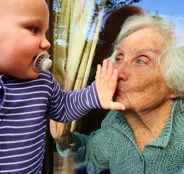 Steph James’ iconic image of her one-year-old son with his great grandmother. Kensington Palace