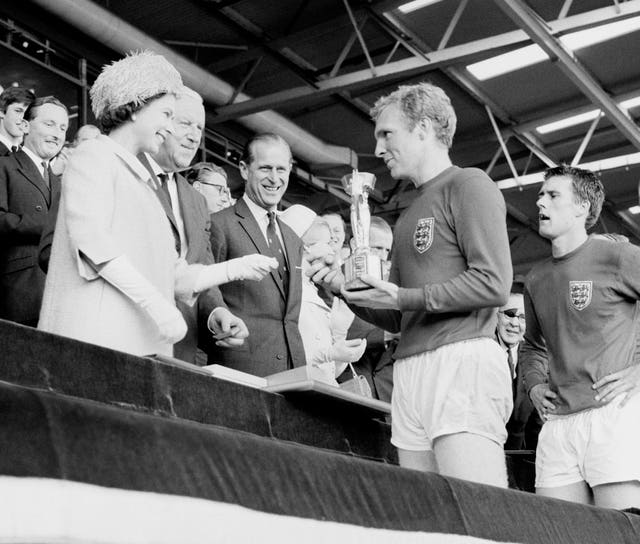 The Queen presented England captain Bobby Moore with the trophy after England won the 1966 World Cup at Wembley