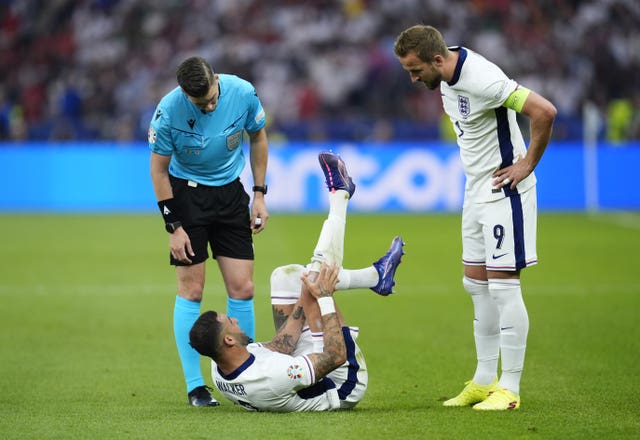 England’s Kyle Walker looks in pain after picking up a possible injury