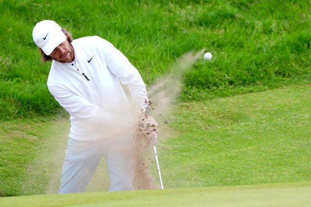 Tommy Fleetwood hits his ball out of a bunker at the Open in July. 