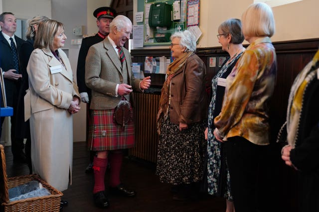 Charles with various volunteers and charity staff