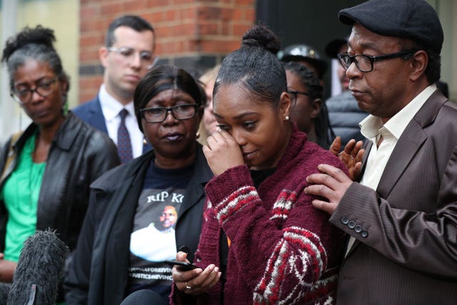 Wendy Clarke (second left) and Tellecia Strachen (second right), the mother and sister of Kevin Clakre, address the media 