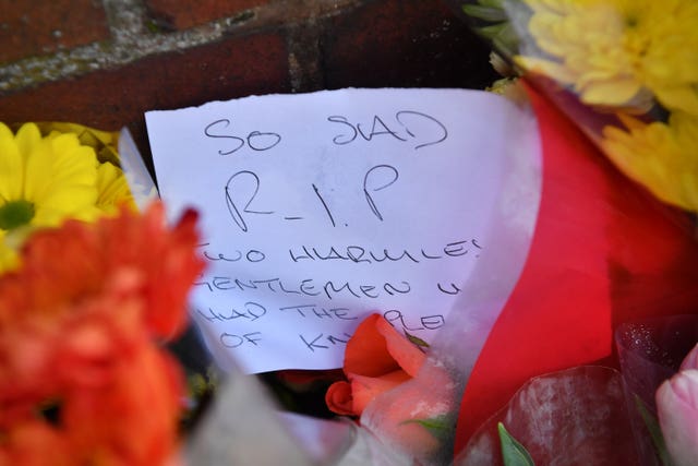 A note and a floral tribute left outside the Cowick Lane property (Ben Birchall/PA)